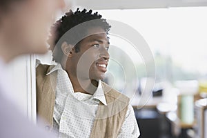 Businessman With Blurred Colleague Looking Away