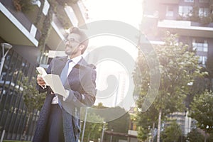 Businessman with book outdoor