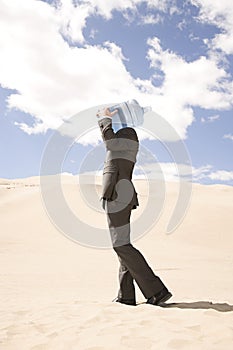 Businessman with bottle of water