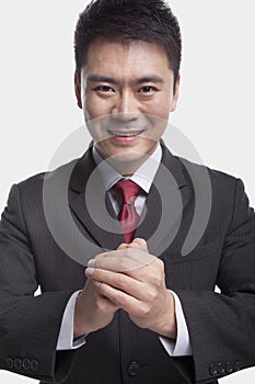 Businessman Bowing Toward Camera