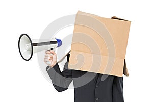 Businessman with box on head holding megaphone