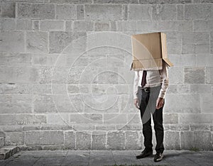 Businessman with a box on his head