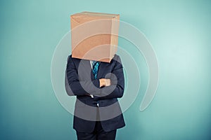 Businessman with a box on his head