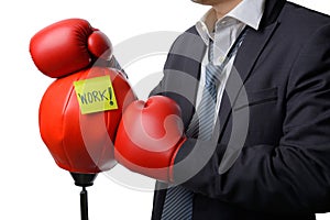 Businessman with boxing glove ready to fight with work, business