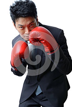 Businessman with boxing glove ready to fight with work, business