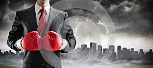 Businessman In Boxing Gloves With Cityscape