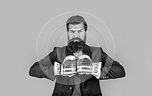 Businessman with boxing gloves. Man in suit and american boxing gloves, business winner. Black and white