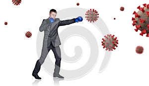 Businessman in boxing gloves punch the coronavirus cells.