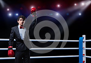 Businessman with boxing gloves in the ring