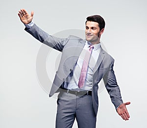 Businessman bragging about the size of something photo