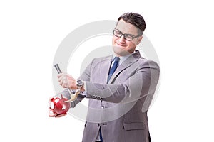 The businessman breaking piggybank isolated white background