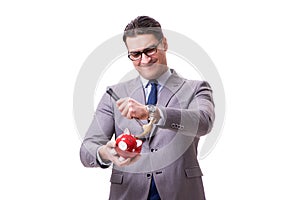 The businessman breaking piggybank isolated white background