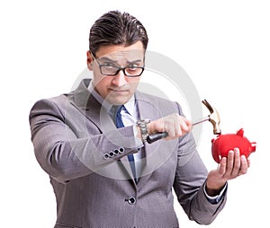 Businessman breaking piggybank isolated white background