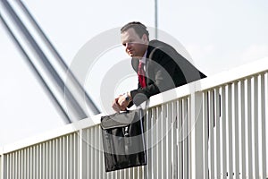 Businessman on bridge