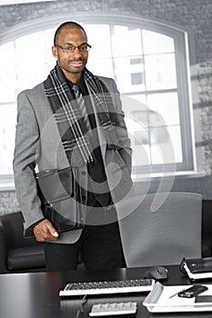 Businessman with briefcase in office