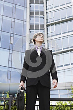 Businessman With Briefcase Outside Building