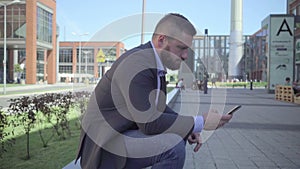 Businessman browsing smarphone, steadicam