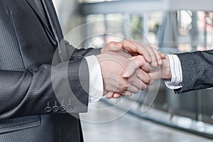 Businessman buddy shakes hands with businesswoman