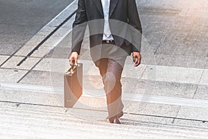 Businessman and Business woman up the stairs