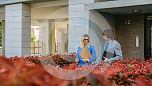 Businessman and businesswoman leaving the office