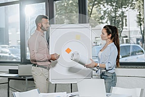 businessman and businesswoman preparing to presentation