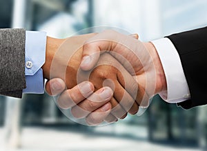 Businessman and businesswoman shaking hands