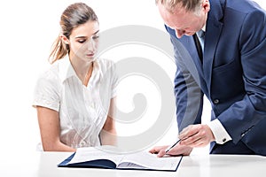 Businessman and businesswoman signing a papers