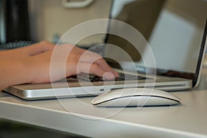 Businessman or Businesswoman Typing On Laptop Computer In office