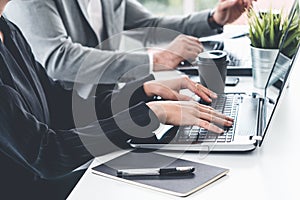 Businessman and businesswoman working in office.