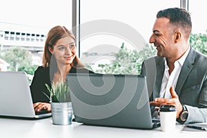 Businessman and businesswoman working in office. uds