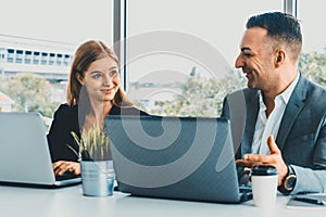 Businessman and businesswoman working in office. uds