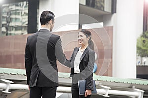 Businessman and businesswomen making handshake agreement.