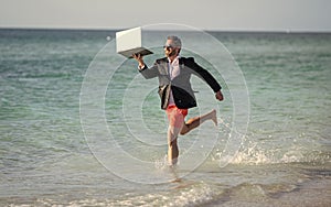 businessman is busy at retreat. summer vacation of manager business man. Businessman manager enjoying a beach break