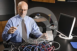 Businessman with cables