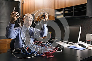 Businessman with cables photo