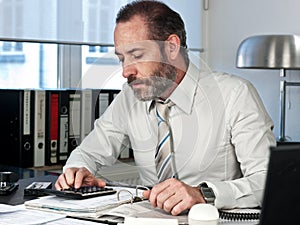 Businessman calculating finance photo