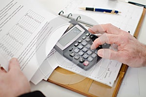 Businessman calculating financial results