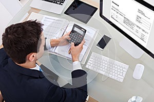 Businessman calculating tax