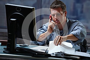 Businessman on call in overtime