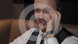 Businessman is calling somebody in cafe