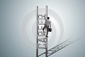 The businessman in career ladder concept