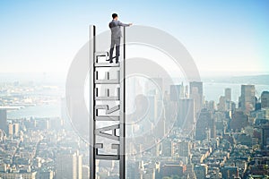 The businessman in career ladder concept