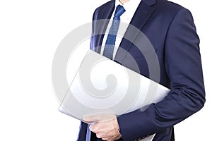 Businessman carries laptop under arm isolated on white background