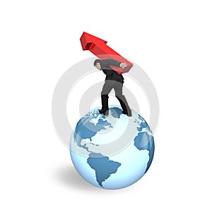 Businessman carrying arrow up standing on globe world map