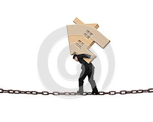 Businessman carrying wooden house balancing on chain