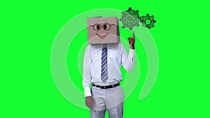 Businessman with a carton on the head pointing at animated grears