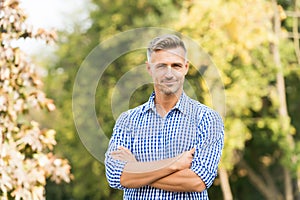 Businessman in casual clothes. Handsome man nature background copy space. Confident man. Good looking guy outdoor. Male