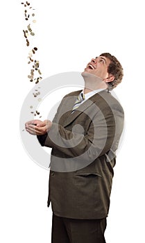 Businessman catching falling money