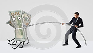 A businessman catching several money bills that have eyes and legs with a rope.