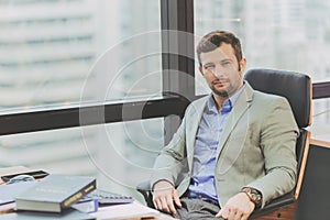 Businessman caucasion portait smile sitting in office photo